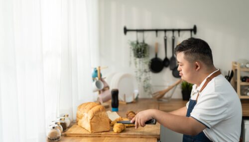 Asian,Young,Man,With,Down,Syndrome,Baking,Bakery,In,Kitchen