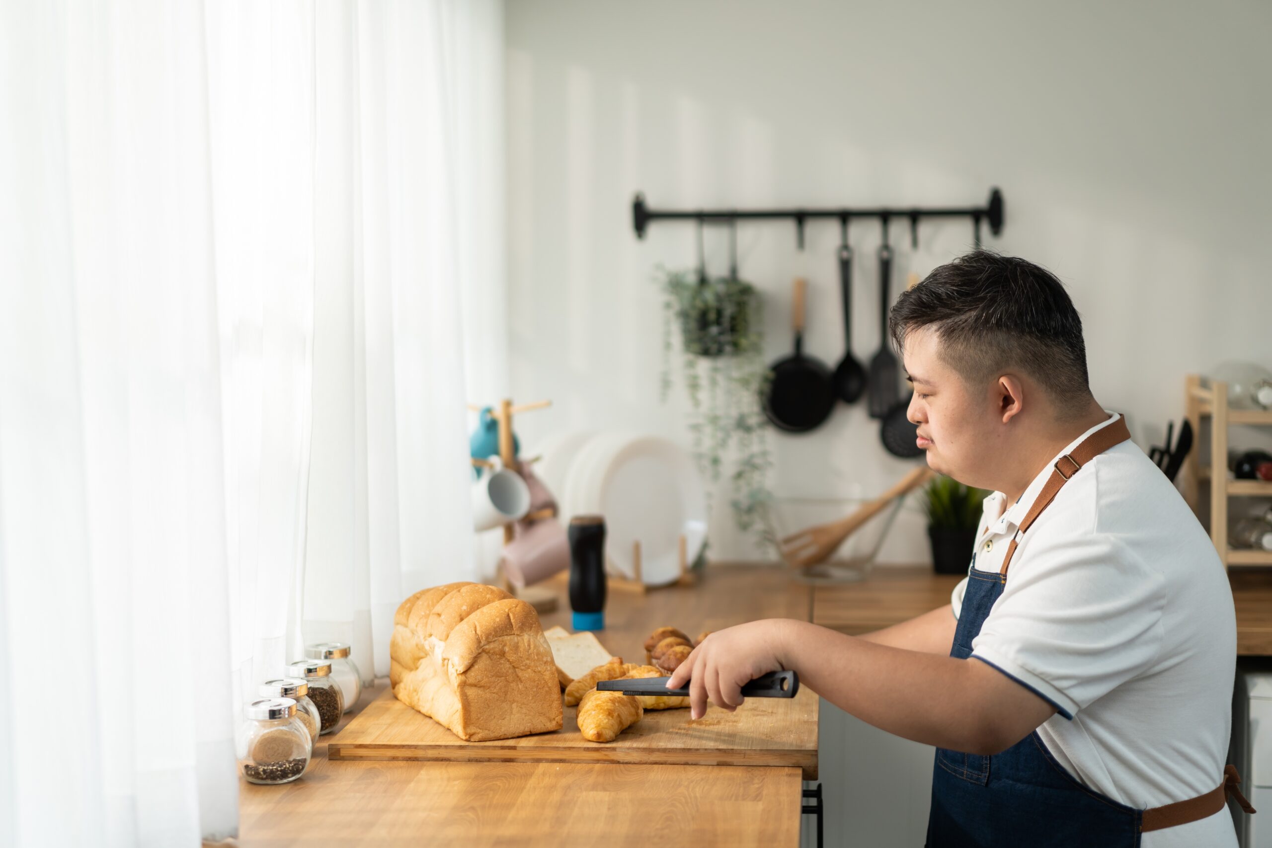 Asian,Young,Man,With,Down,Syndrome,Baking,Bakery,In,Kitchen